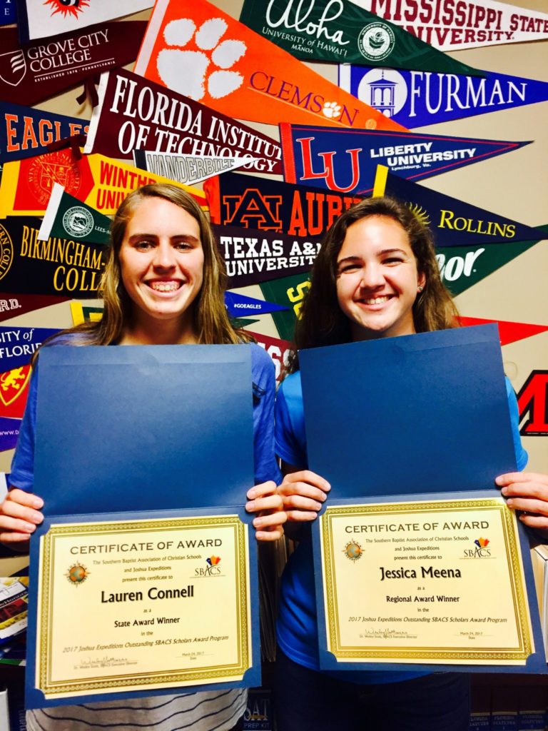 Lauren and Jessica pose with their certificates